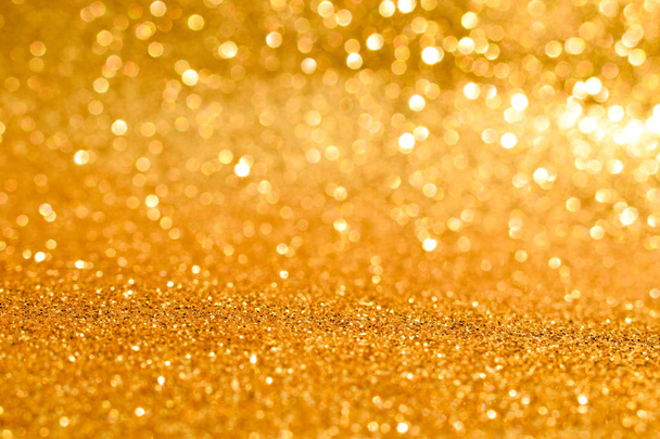 sparkles of golden glitter abstract background - Photo, Image