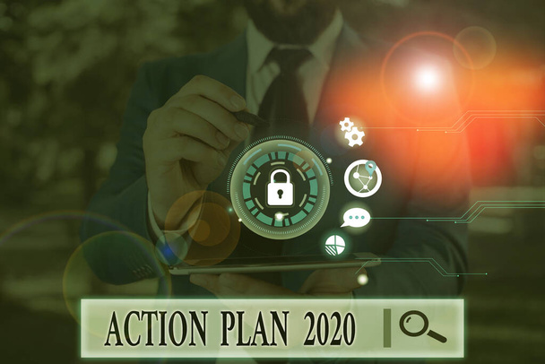 Texto manuscrito Plan de Acción 2020. Concepto que significa hacer la lista contiene el número de cosas que se harán el próximo año
. - Foto, imagen