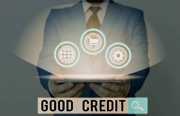 Piszę notatkę z "Good Credit". Biznes zdjęcie showcasing kredytobiorca ma stosunkowo wysoki wynik kredytowy i bezpieczne ryzyko kredytowe. - Zdjęcie, obraz