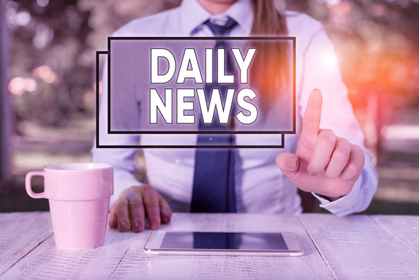 Text sign showing Daily News. Conceptual photo information or reports about recent events published everyday Female business person sitting by table and holding mobile phone. - Photo, Image