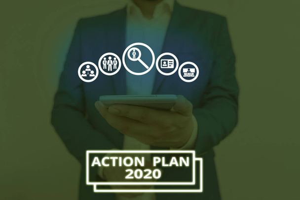 Texto manuscrito Plan de Acción 2020. Concepto que significa hacer la lista contiene el número de cosas que se harán el próximo año
. - Foto, imagen