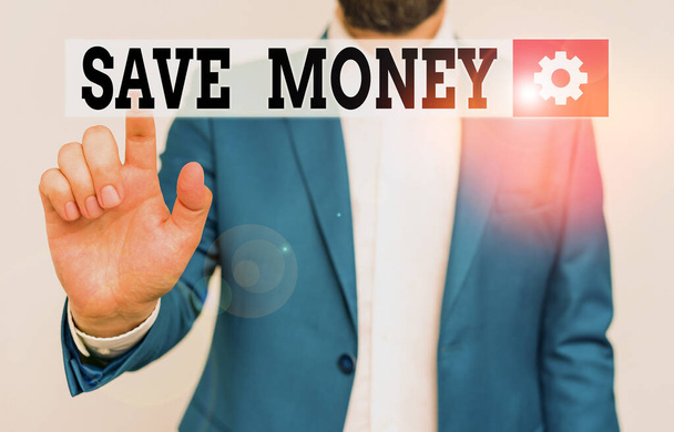 Handwriting text Save Money. Concept meaning store some of your cash every month to use them sometime later Businessman in blue suite and white shirt pointing with finger in empty space. - Photo, Image