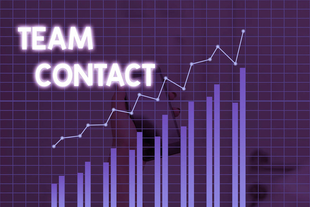 Handschrift tekst Team Contact. Concept betekent De interactie van de individuen in een team of groep. - Foto, afbeelding