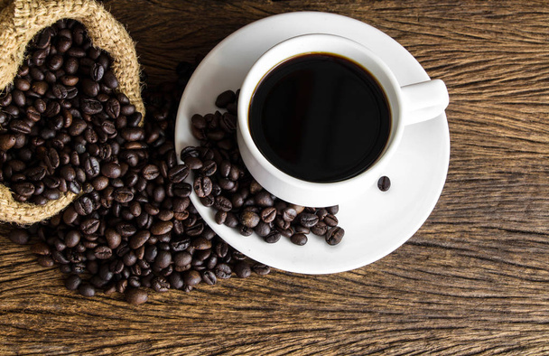 cup of coffee on wooden background  - Фото, зображення