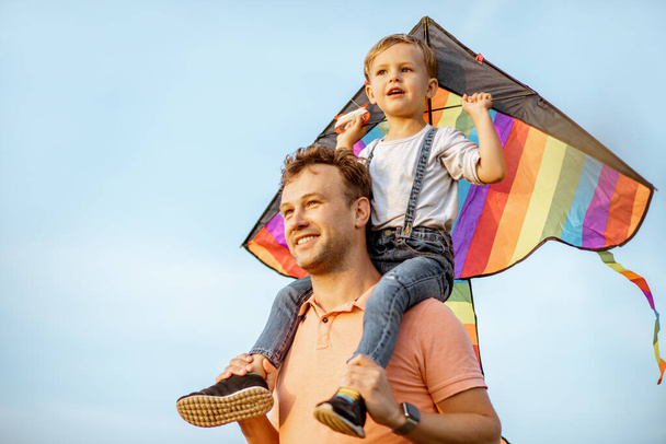 Father and son with air kite outdoors - Photo, Image