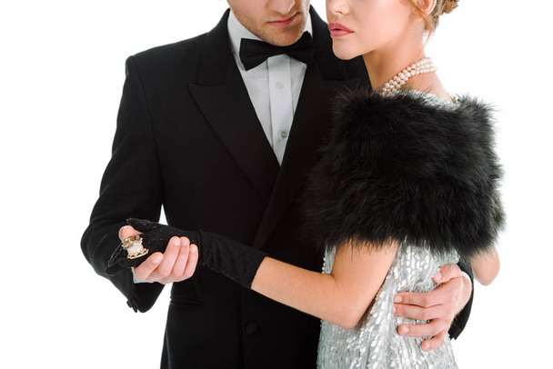 cropped view of aristocratic man and woman holding hands isolated on white  - Фото, зображення