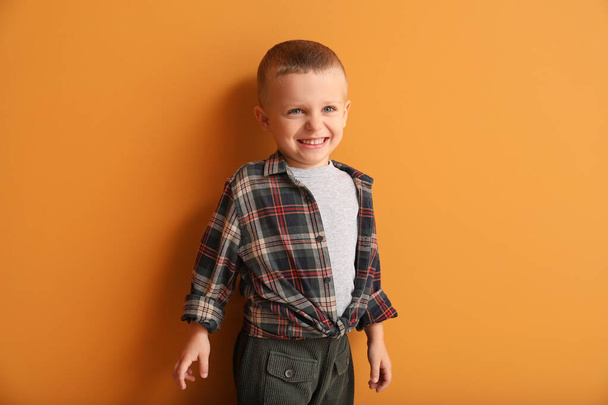 Portrait of cute little boy on color background - Photo, Image