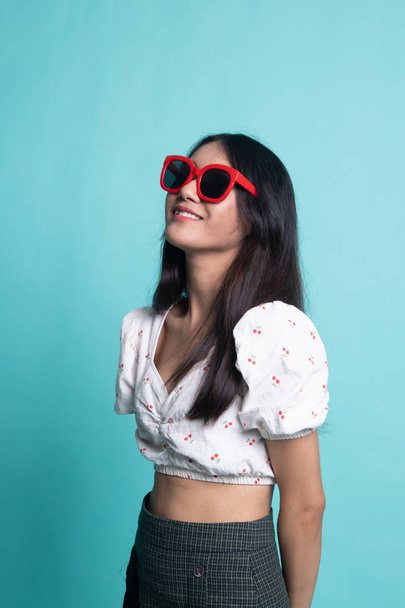 Portrait of a beautiful young asian girl in sunglasses. - Photo, image