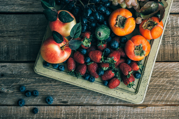 Fresh fruits. Assorted fruits colorful background. Organic food. Fresh raw fruits and berries. Autnum harvest. - Фото, изображение