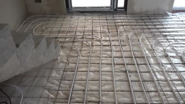 Underfloor heating system pipes on the floor. Floor heating manifold place - Footage, Video