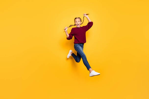 Turned full length body size photo of cheerful positive ecstatic overjoyed girl in jeans denim footwear burgundy sweater expressing astonishment isolated vivid color background - Foto, immagini
