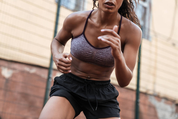 Image of active african american woman doing workout at playgrou - Photo, Image