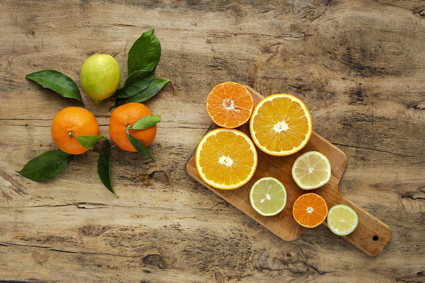 oranges, tangerines and lemons seen from above - Фото, зображення