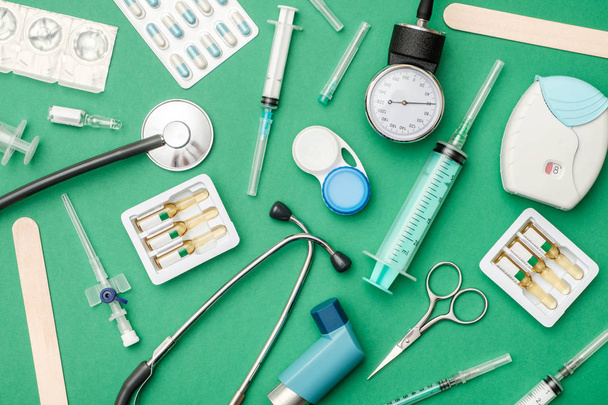 Flat lay of medical tools on colored background - 写真・画像