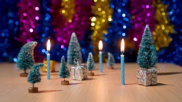 Christmas trees and gifts with candles burning in timelapse - Footage, Video
