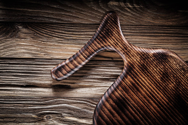 very close up view on vintage cutting board on old wood - 写真・画像