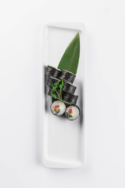 tasty sushi rolls on white background, Japanese food - Photo, Image
