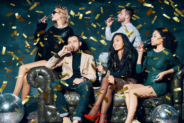 Diverse group of friends having fun enjoying party and drinking champagne - 写真・画像
