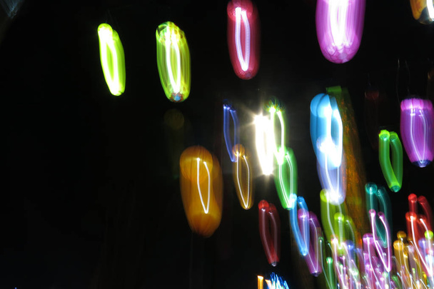 abstract photo of colorful lights in the dark background - Valokuva, kuva