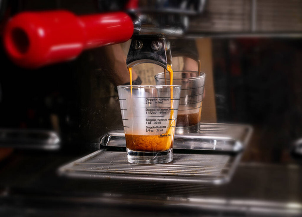 Making espresso in white mug in coffeeshop or cafe closeup - Photo, Image