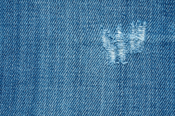Niebieska tekstura tła, jeansy tekstury, tkaniny. Jeansowe tło dżinsów. - Zdjęcie, obraz