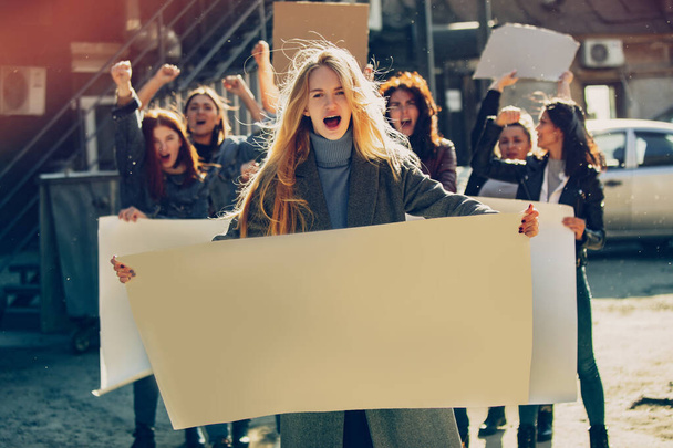 Young people protesting of women rights and equality on the street - Foto, Imagen