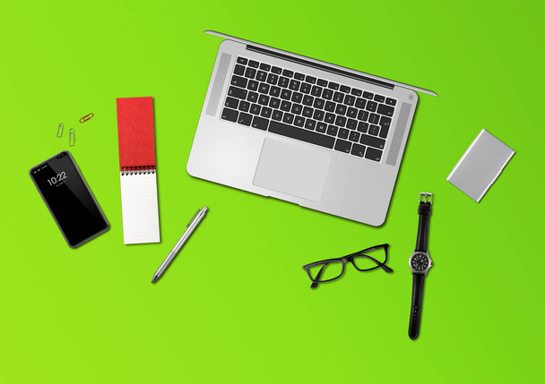 Office desk mockup top view isolated on green - Foto, Imagen