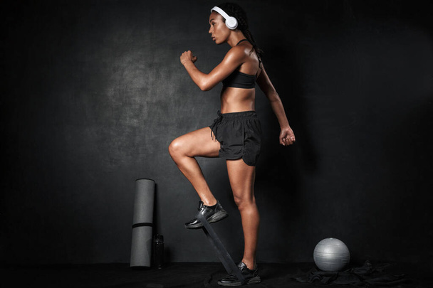 Image of african american woman doing workout with expander equi - Fotografie, Obrázek