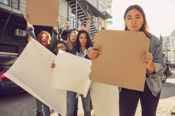 Young people protesting of women rights and equality on the street - Photo, image