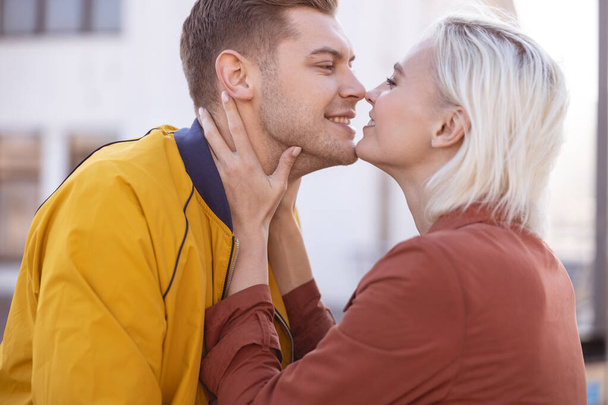 Happy loving couple almost kissing each other - Valokuva, kuva