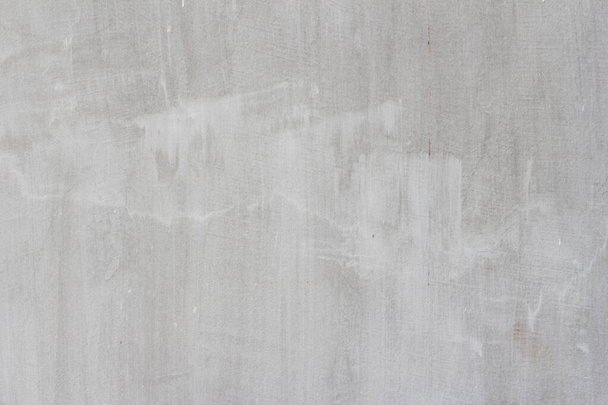 Gray concrete wall texture of a construction worker with stripes and scratches - Foto, imagen