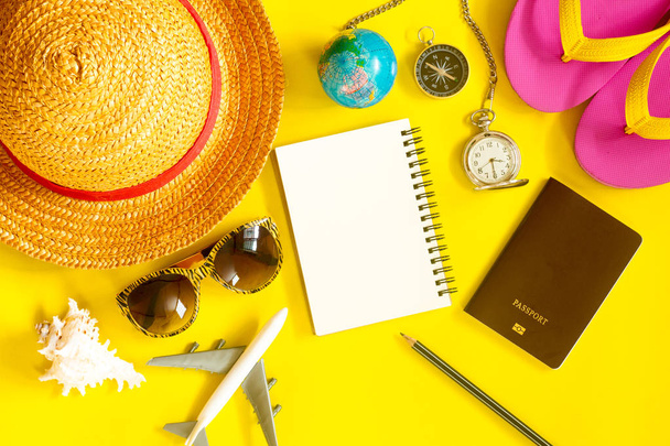 Preparing travelers' accessories on a yellow background Travel c - Photo, Image