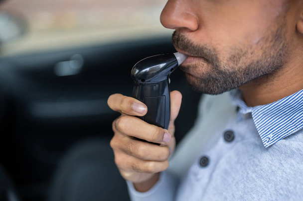 Man Sitting Inside Car Taking Alcohol Test - Photo, Image