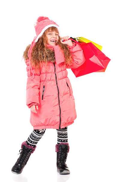 Little girl in winter clothing - Фото, изображение