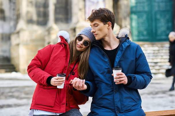 A trendy young couple walks in the city at christmastime - Foto, Bild