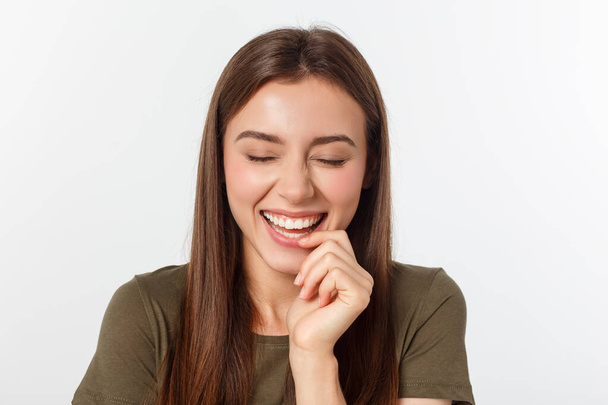 Portrait joyful outgoing woman likes laugh out loud not hiding emotions giggling chuckling facepalm close eyes smiling broadly white background - Photo, Image