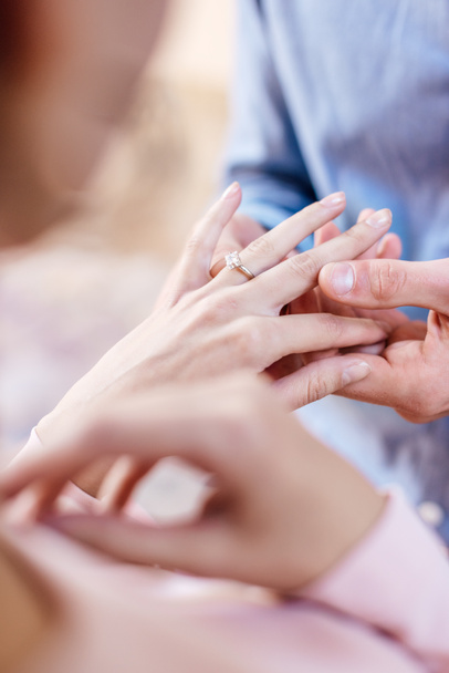 cropped view of man putting wedding ring on finger of girlfriend  - Photo, Image