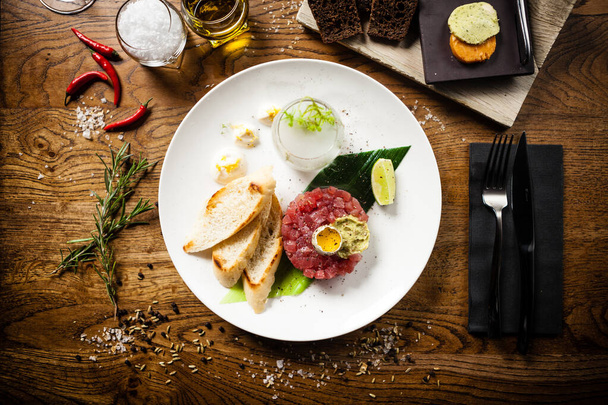 Tuna tartare served on a plate in restaurant - Photo, Image