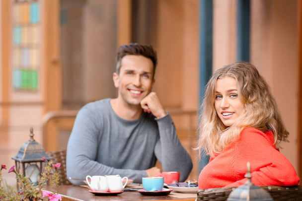 Happy young couple on romantic date in cafe - Photo, Image