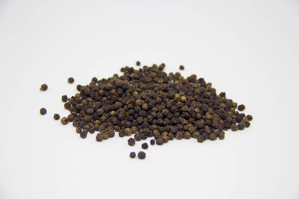 slide of black pepper on a white background - Photo, Image