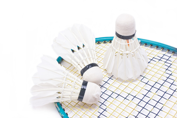 Shuttlecock with badminton racket isolated on white background. - Фото, изображение