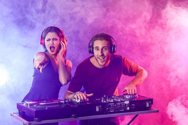 Young djs playing music in nightclub - Photo, Image