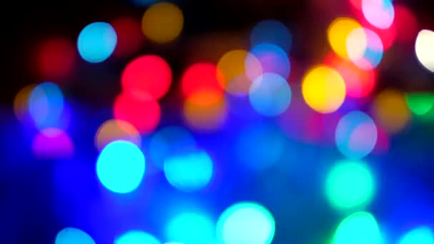 Abstract blurred of colored glittering shine bulbs lights on black background. - Footage, Video