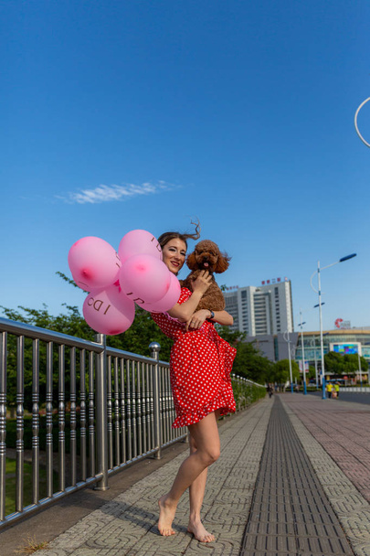 portrait of a girl with pink balloons - Zdjęcie, obraz