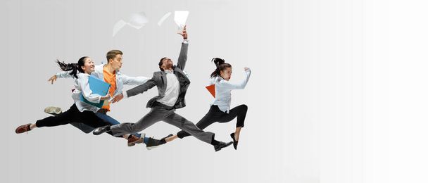 Office workers or ballet dancers jumping on white background - Foto, Imagem
