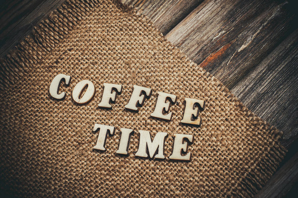 Inscription coffee on a vintage surface on a brown bag - Zdjęcie, obraz