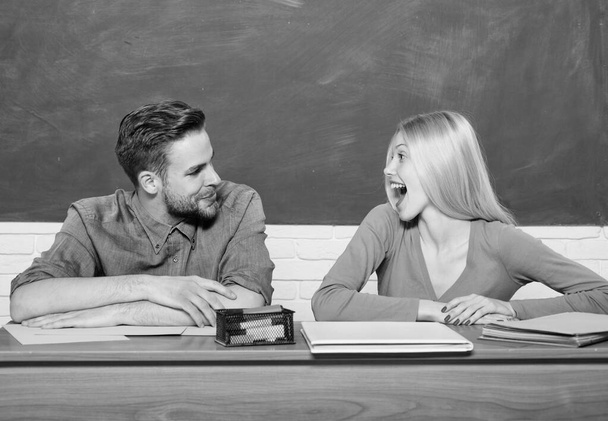 Couple of man and woman in classroom. Modern school. Knowledge day. Home schooling. Back to school. Student life. Lesson and blackboard. Teachers day. Happy couple. Feeling happy and relaxed - 写真・画像