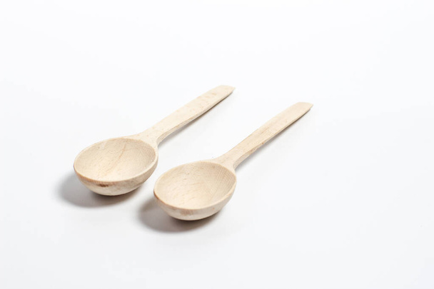 Beautiful bright wooden spoons for food and spices. - Foto, Imagen