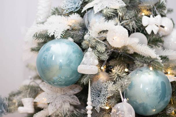 Christmas tree decoration. Christmas toys on the Christmas tree. Background toys on the Christmas tree. Holiday. New year and Christmas. Interior. - Photo, Image