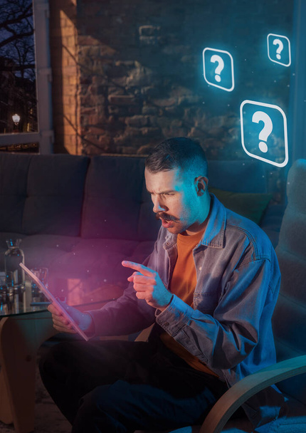 Man using gadget and receive neon notifications at home at night - Foto, Imagem